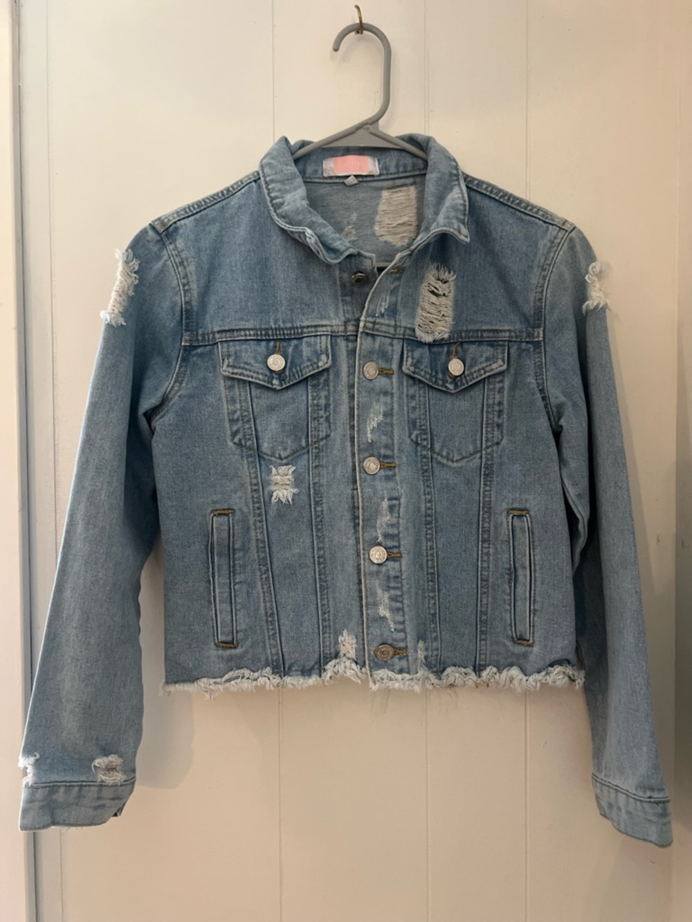 Distressed Light Blue Denim Jacket with Frayed Hem